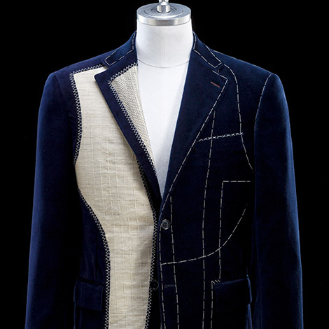Suit construction detail — official Huebscher product imagery